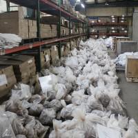 Inside of the Alabama Graphite USA office, in Sylacauga, Alabama. Bulk sample bags collected from trenching programs at both the Coosa and Bama properties can be seen, as well as drill core and pulp samples organized on the warehouse racks