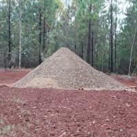 Extra over-sized oxidized graphitic schist from the 200 t of crushed material prepared on site at the Coosa Graphite Project, for the SGS pilot-plant study